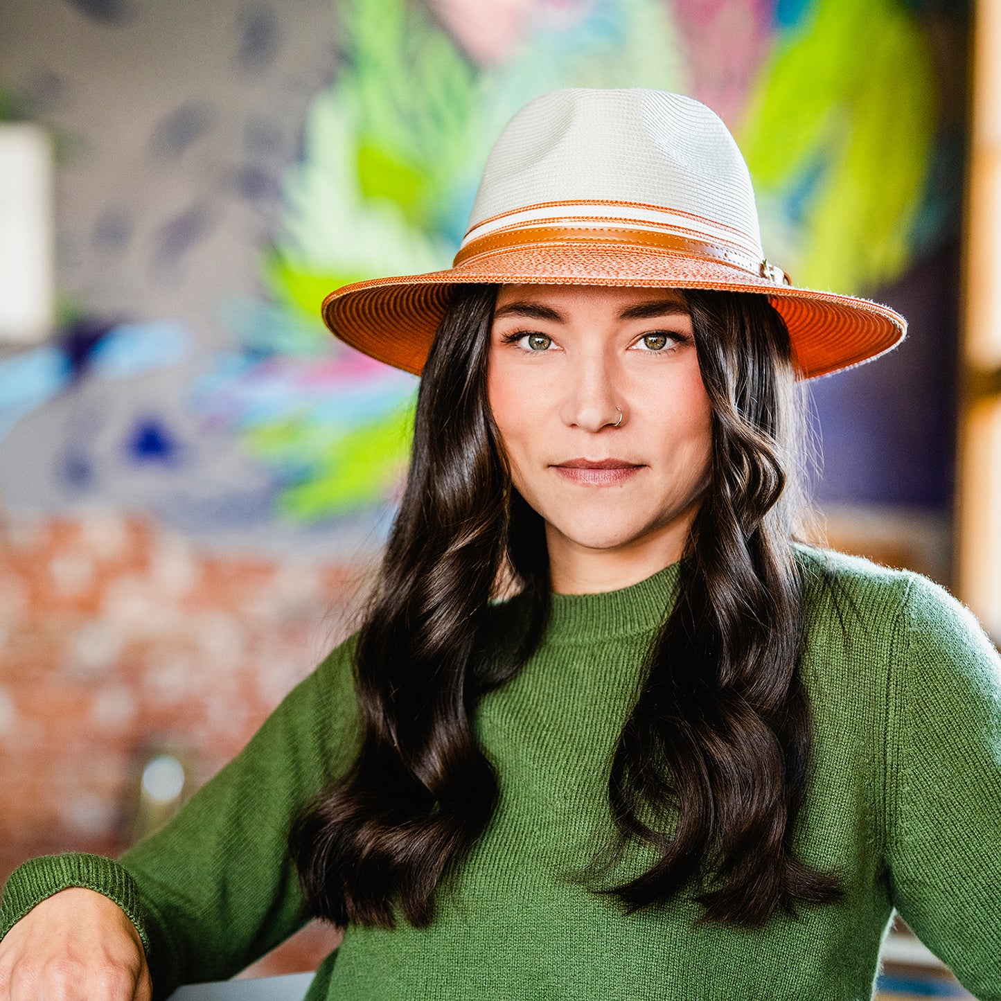 Woman wearing a Kristy packable fedora sun hat Wallaroo, Ivory/Coral