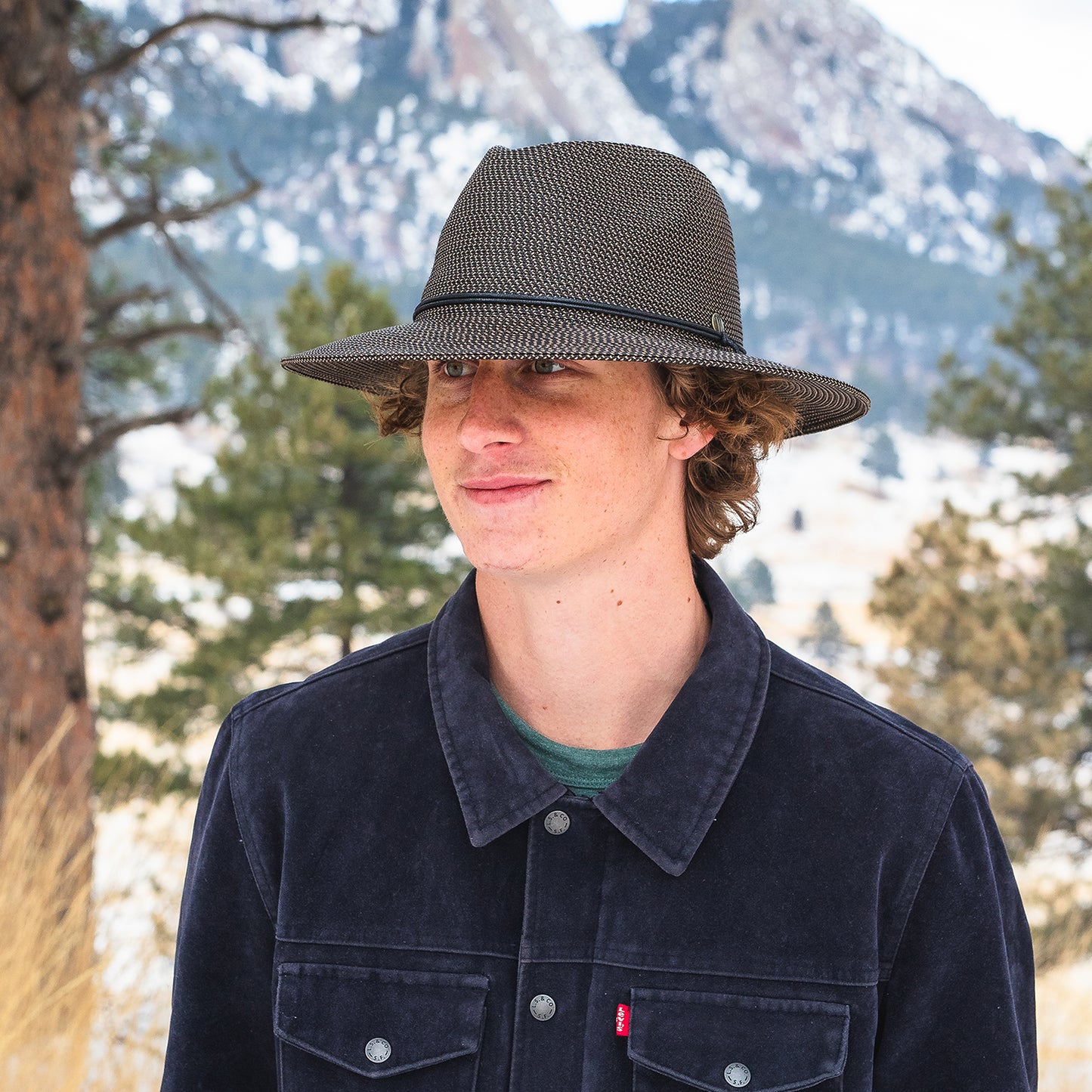 Young man wearing Logan hat, Dark Brown