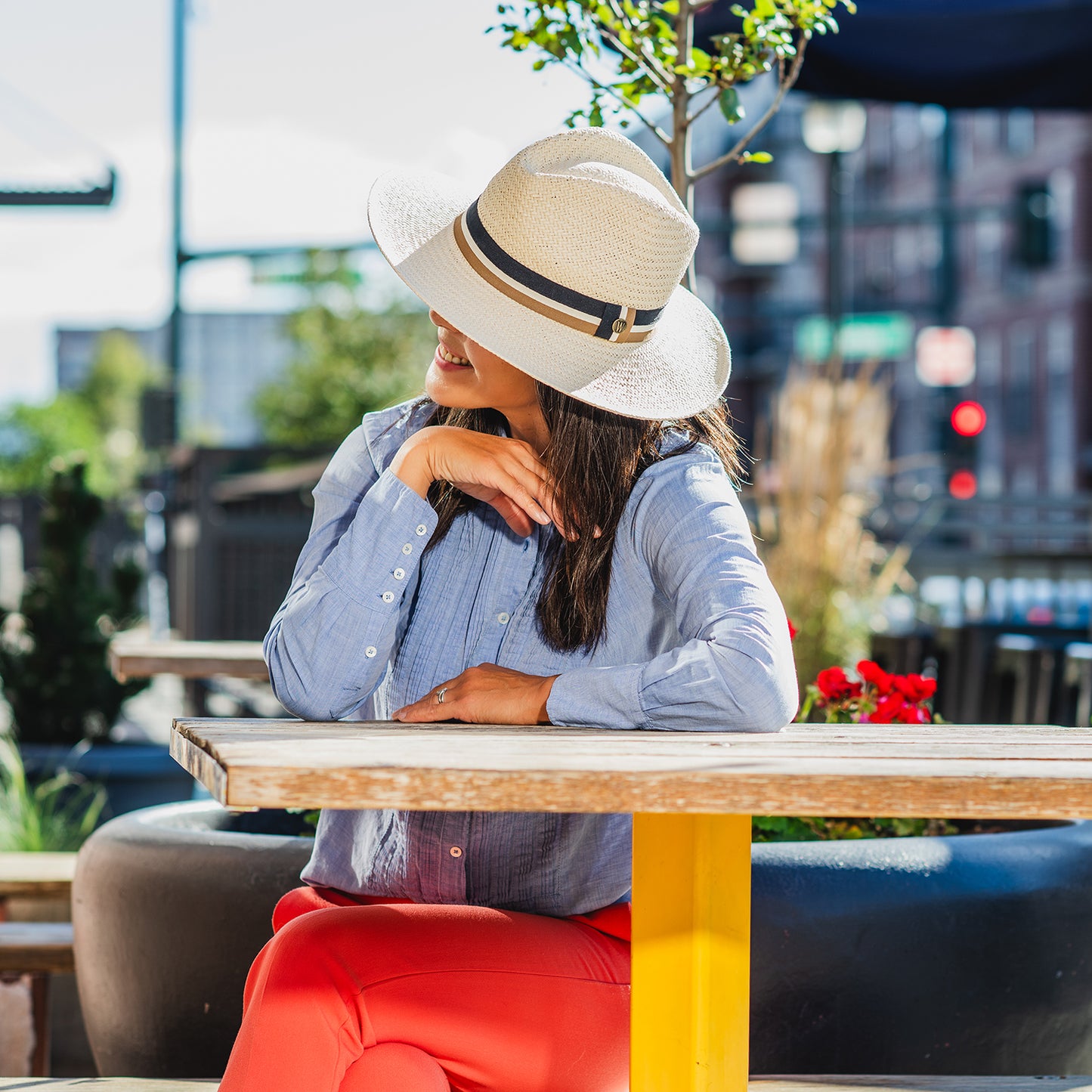 Woman wearing a summer beach hat at a cafe by Wallaroo, Ivory