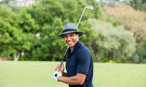 Man wearing a summer sun hat while golfing