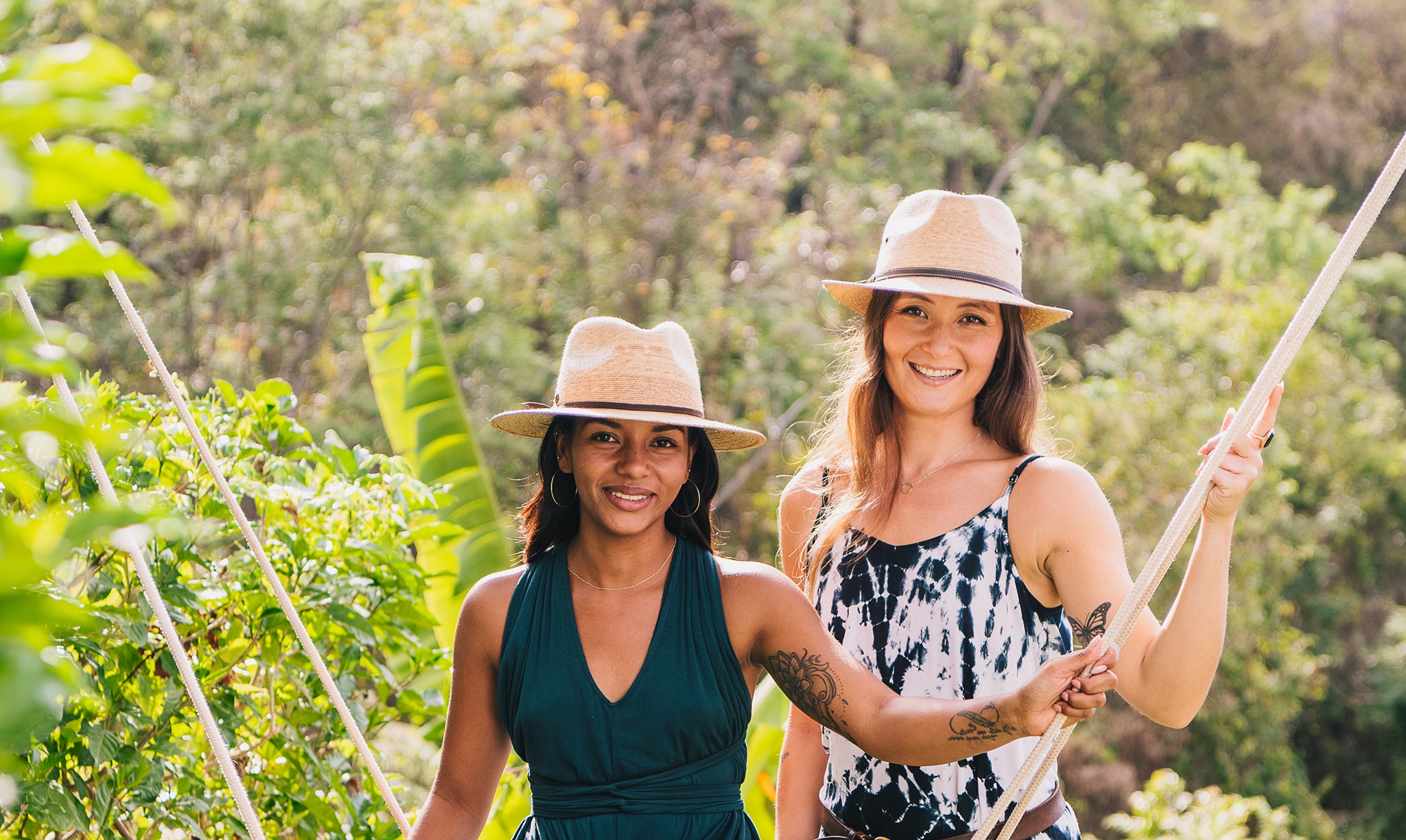 Two women donning the artisan Marina sun hat by Wallaroo