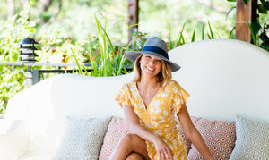 Woman wearing a wide brim summer sun hat by Wallaroo