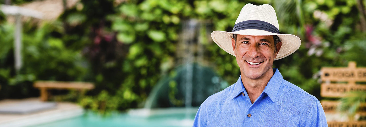 Man by the pool wearing the Portland sun hat by Carkella