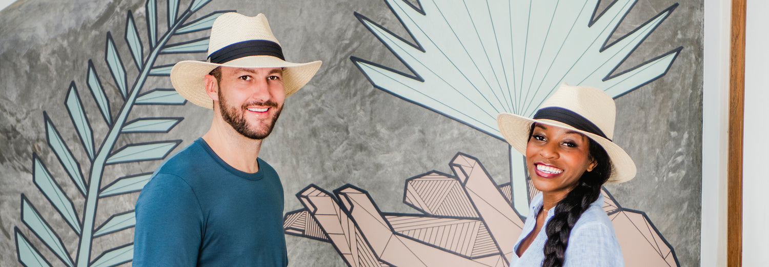 Man and woman standing outside wearing the Portland sun hat by Carkella