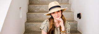 Woman wearing the Paloma sun hat with fringe brim by Wallaroo