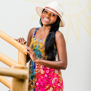 Woman smiling wearing the UPF Avery fedora sun hat by wallaroo