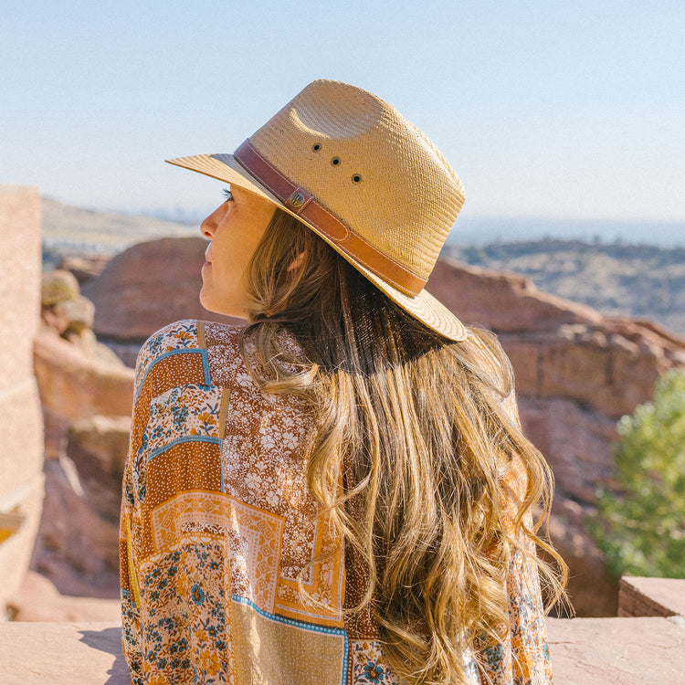 A Women Wearing Unisex Avery Fedora Style UPF Sun Hat Camel from Wallaroo for medium and large heads