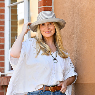 Woman wearing a wide brim sun hat by Wallaroo