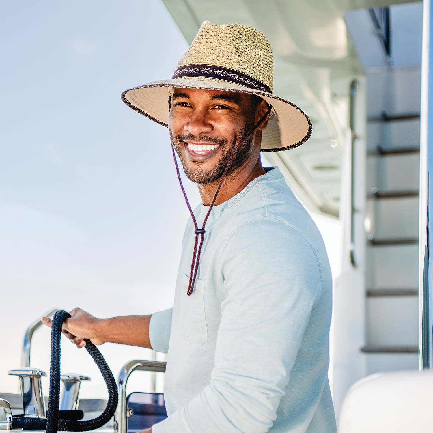 Man wearing a summer beach hat outside by Wallaroo in Natural w/surf trim