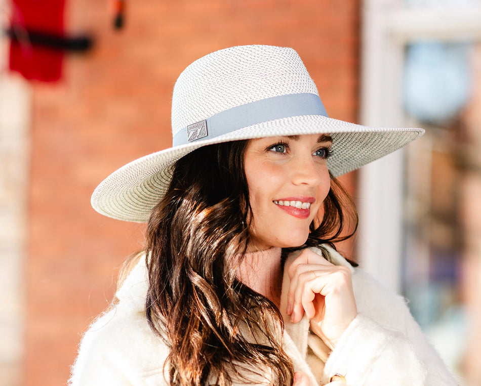 Woman wearing a big wide brim fedora sun hat by Carkella