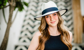 Woman standing outside wearing the Lauren sun hat by Carkella