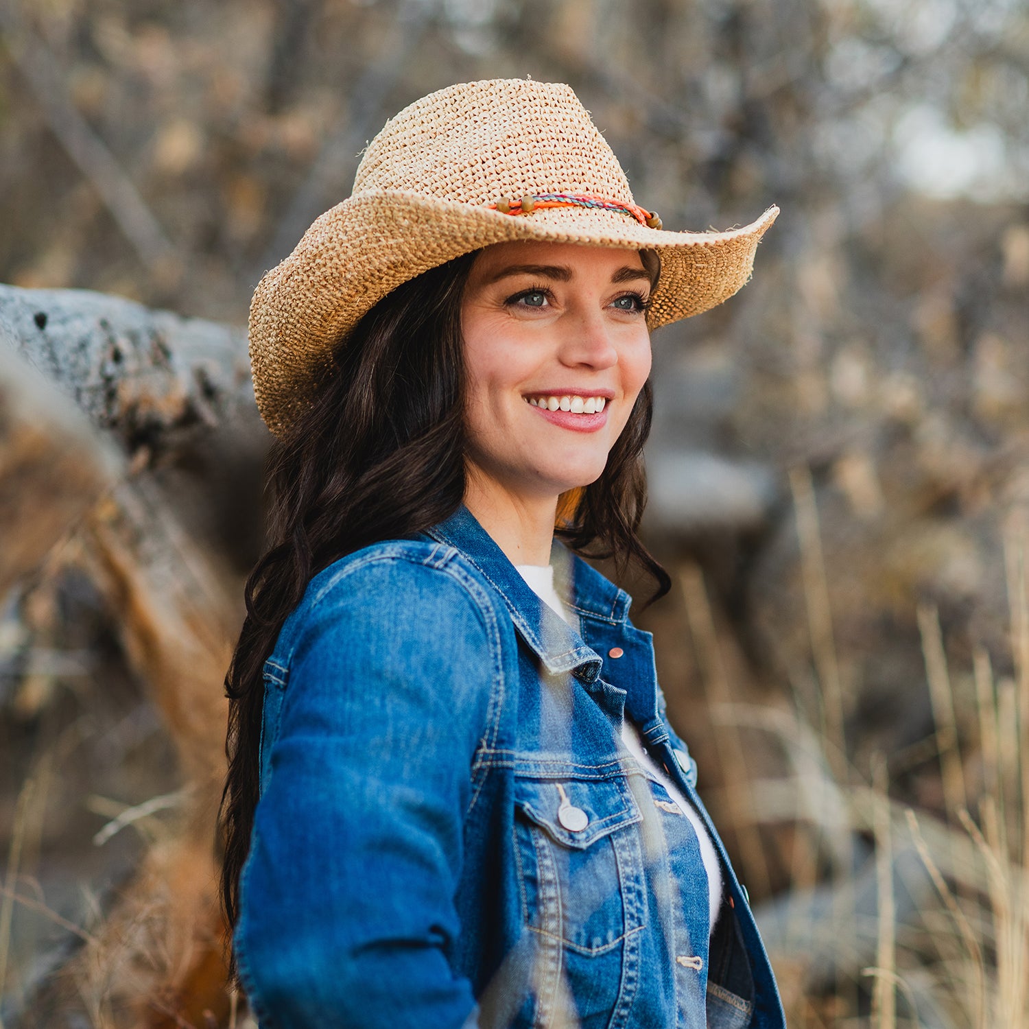 Woman wearing a straw cowboy sun hat by Wallaroo, Natural
