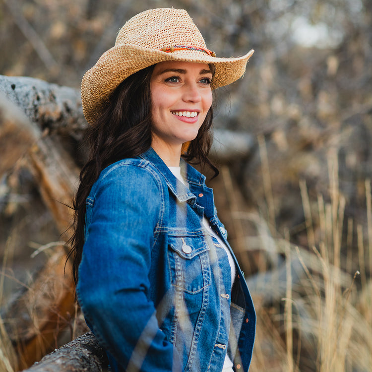 Woman wearing a straw cowboy sun hat by Wallaroo, Natural