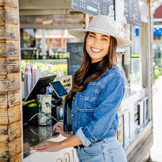 Woman outside wearing a wide brim winter sun hat by Wallaroo