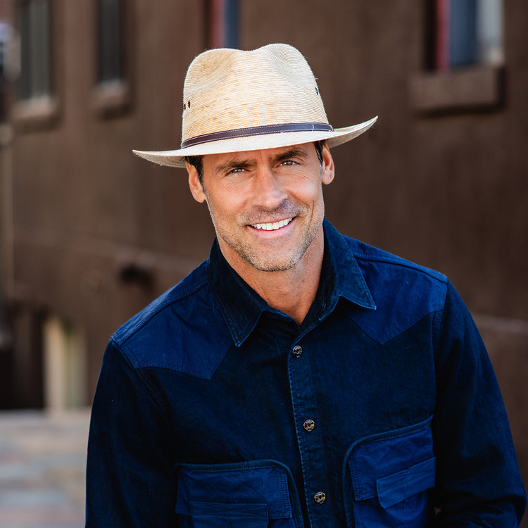 Man wearing an artisanal fedora style sun hat by Wallaroo, Camel