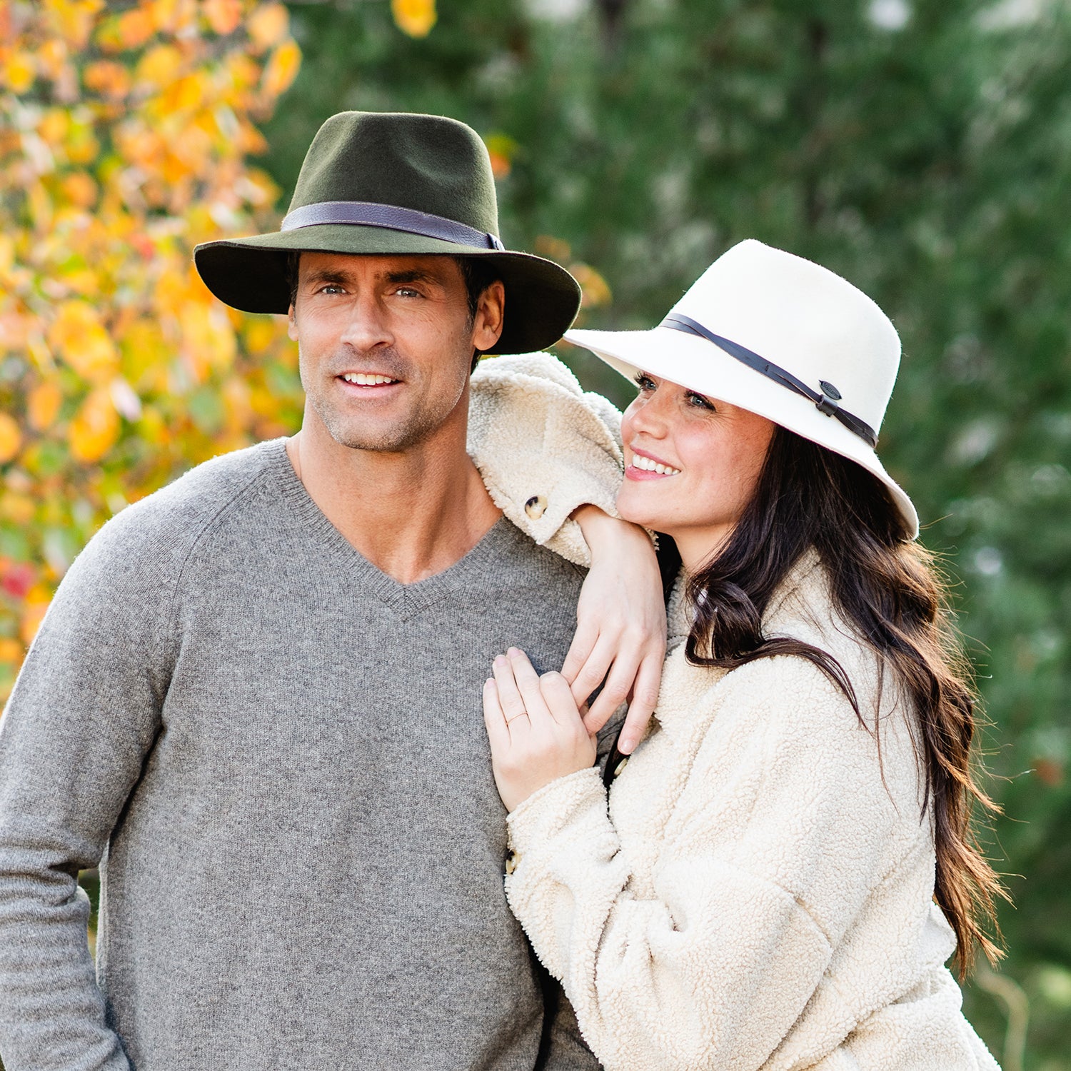 Man wearing a Durango wool-felt style winter sun hat by Wallaroo with woman wearing Aspen winter hat, Olive