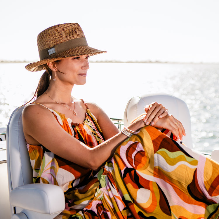 Woman wearing the Carkella Emery i Camel Women's Fedora, featuring a classic design with a breathable fabric for all-day comfort