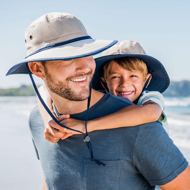 Wallaroo Men's Explorer Bucket Boone sun hat, unisex design, featuring UPF 50+ UV protection, lightweight material, and a wide brim for outdoor adventures, Camel/Navy