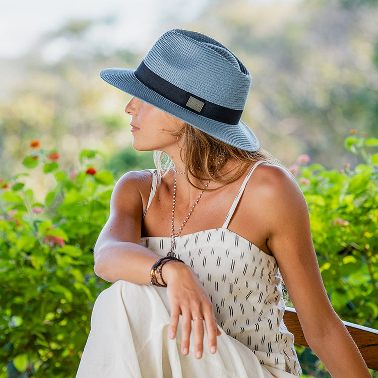 Woman wearing fedora style UPF sun hat in the summer by Carkella