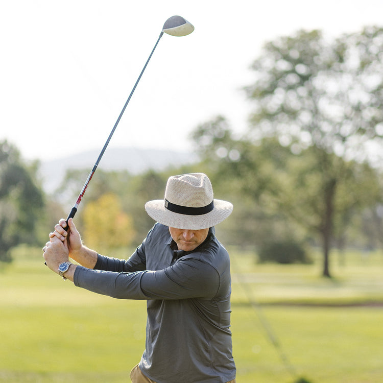 Man wearing the Carkella Fairway Fedora Sun Hat while playing golf, offering stylish sun protection with a wide brim, perfect for long days on the course, Beige