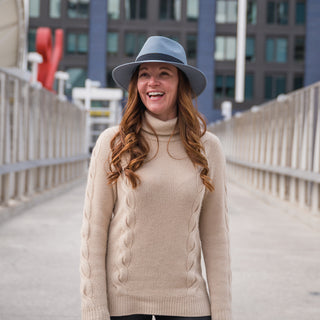 Woman wearing the Carkella Fairway Fedora Sun Hat while in the city, offering a perfect blend of style and sun protection for urban outdoor activities, Blue