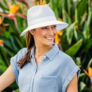 Woman wearing a ponytail sun hat in a garden by Wallaroo