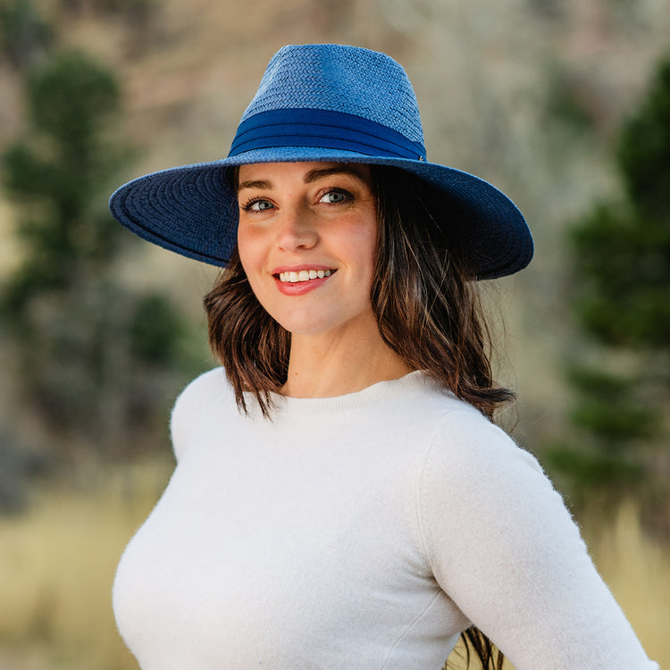 Woman wearing a big wide brim sun hat by Wallaroo