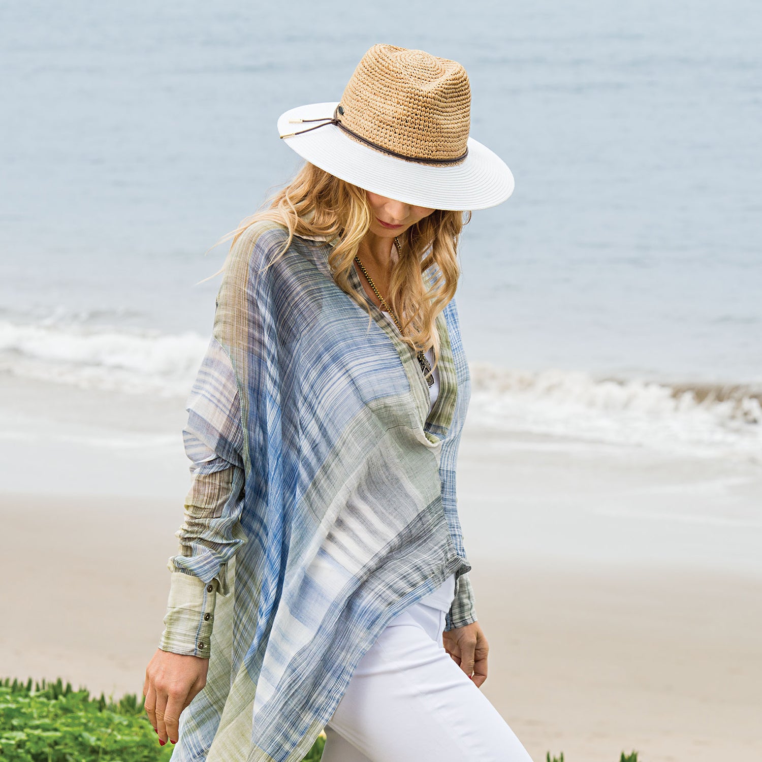 Woman wearing a straw summer hat by Wallaroo, Natural