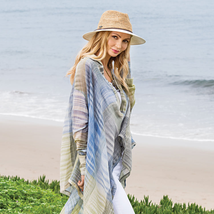 Woman wearing a straw summer hat by Wallaroo, Natural