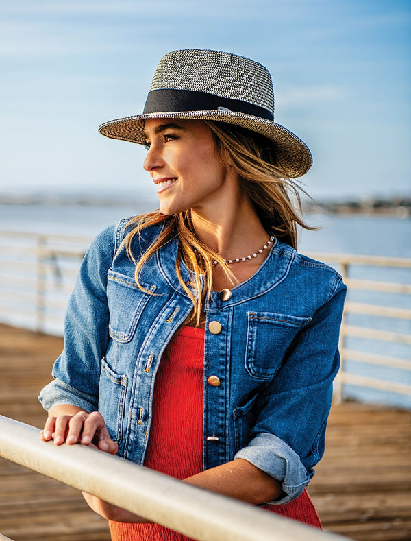 woman on a dock wearing a fedora style sun hat by Wallaroo