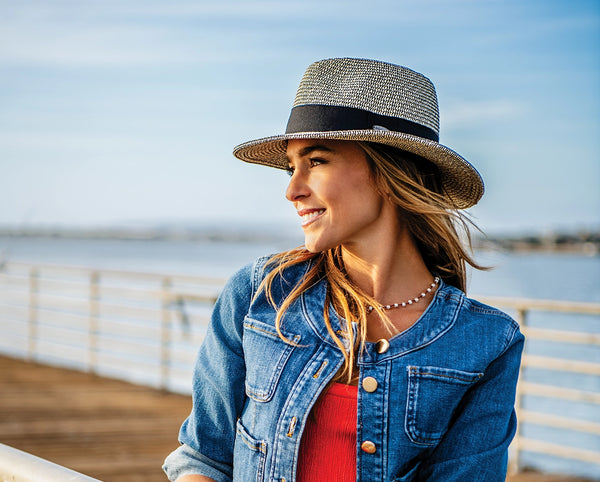 woman standing outside while wearing a fedora sun hat by Wallaroo