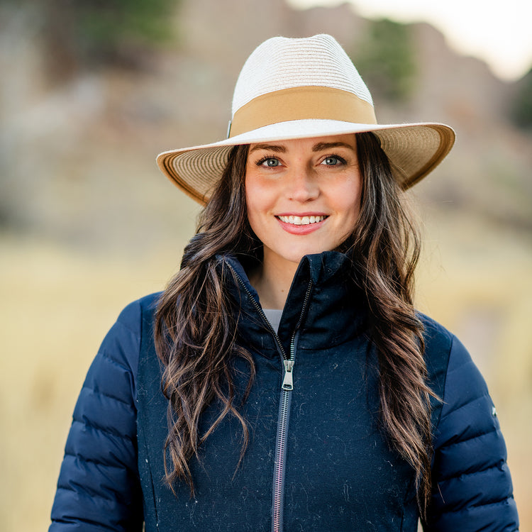 Woman wearing a big wide brim fedora sun hat outside by Wallaroo, Mixed Camel