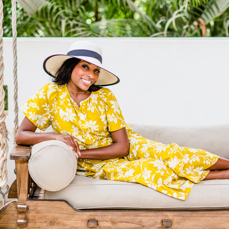 Woman wearing the Wallaroo Jane Seymour Margot sun hat, designed for urban style and sun protection, Ivory