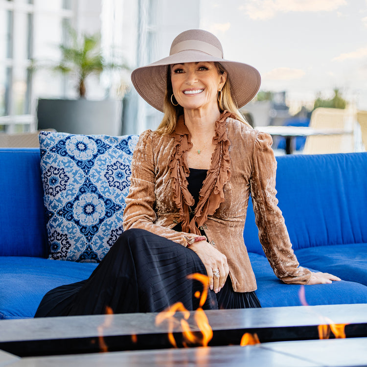 Jane Seymour, showcasing timeless glamour with the Wallaroo Margot UPF 50+ sun hat, inspired by dramatic movie moments, Taupe