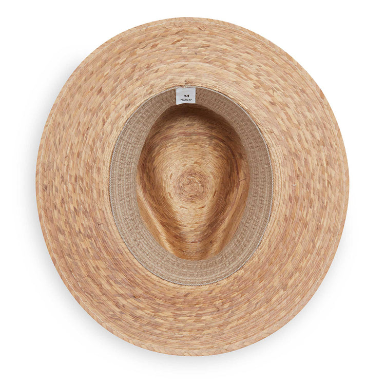 Interior of the Marina artisan straw sun hat by Wallaroo, featuring a UPF 50+ rating
