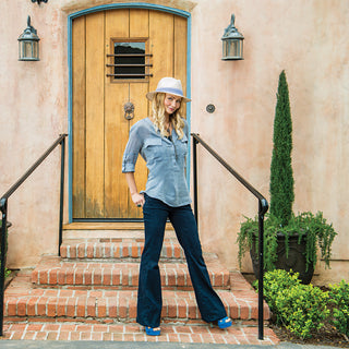 Woman wearing a Monterery straw Sun Hat with a fedora crown by Wallaroo, 'Natural w/Blue Pinstripe'