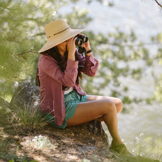 Woman outside wearing a wide brim sun hat by Wallaroo, Natural