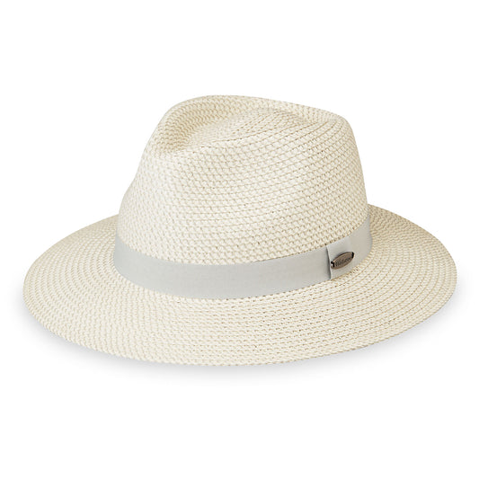 A side-profile view of the Petite Charlie UPF 50+ fedora hat in ivory pewter, featuring an ivory woven crown and brim, a light gray ribbon band around the crown, and a small metal logo badge on the side, shown against a plain white background.