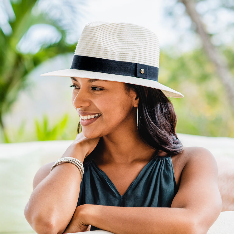 Woman wearing a summer fedora beach hat by Wallaroo, Ivory