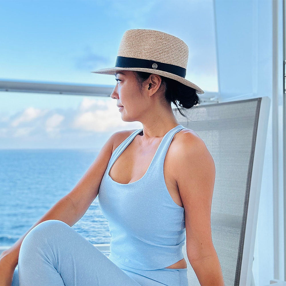 Woman wearing a summer fedora beach hat by Wallaroo, Beige