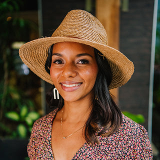 Woman wearing a summer straw sun hat by Wallaroo
