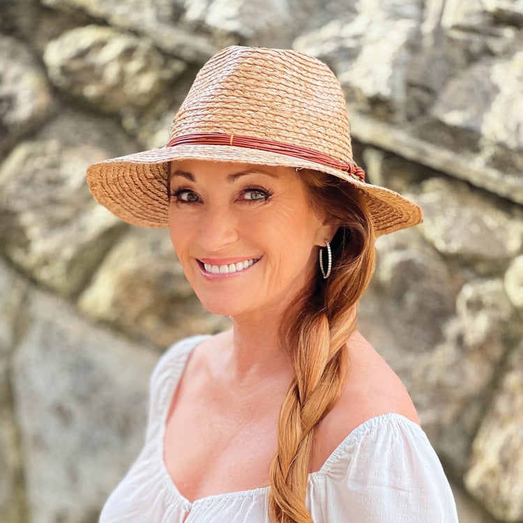 Woman wearing a summer straw sun hat by Wallaroo, Camel