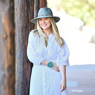 woman wearing a upf fedora sun hat by Wallaroo, Sage, S/M (58cm)