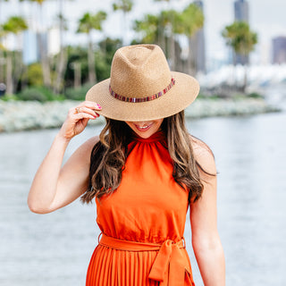 Woman outside wearing the petite sedona beach sun hat with UPF 50+ rating, Camel