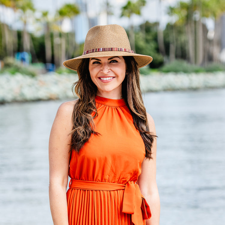 Woman outside wearing the sedona beach sun hat with UPF 50+ rating, Camel