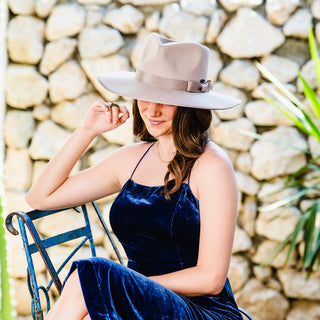 Woman wearing a wide brim winter sun hat, Taupe