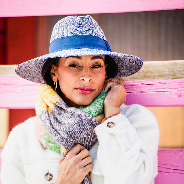 Woman Wearing Packable Wide Brim Fedora Style St. Lucia UPF Sun Hat from Wallaroo, Navy Combo