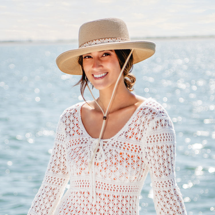 Woman outside wearing a wide brim sun hat by Wallaroo, Camel