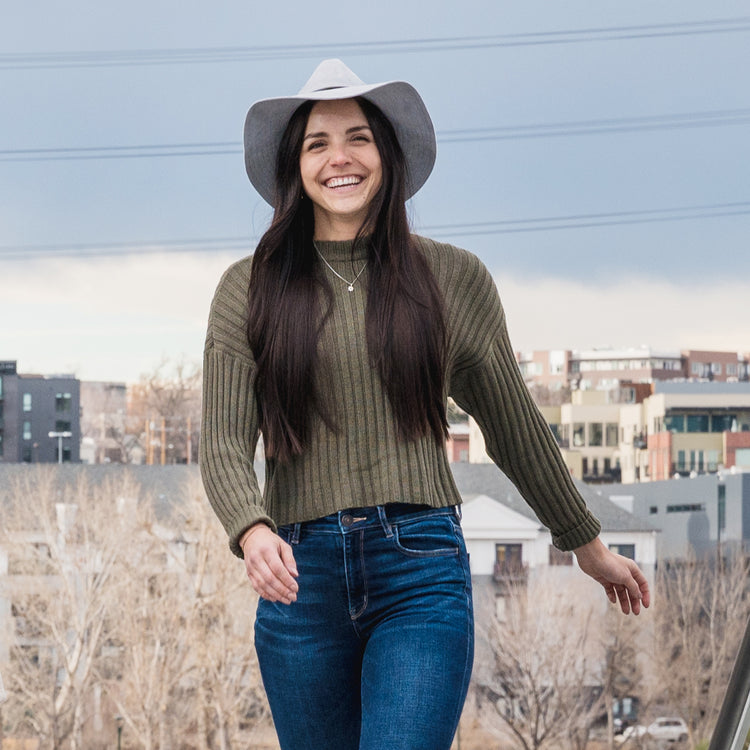 woman outside wearing a faux suede fedora sun hat by Wallaroo, Light Grey