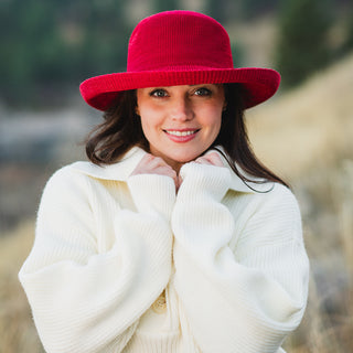 Woman wearing a big wide brim sun hat outside by Wallaroo